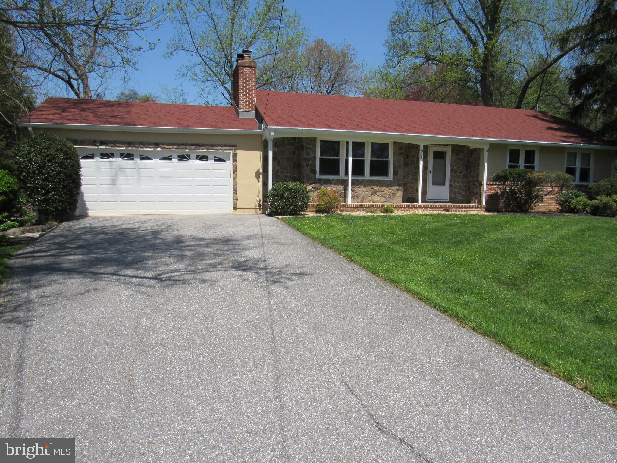 8710 Windsor Mill Road Baltimore, MD 21244 - Photo 1 of 30 a front view of a house with a garden and porch