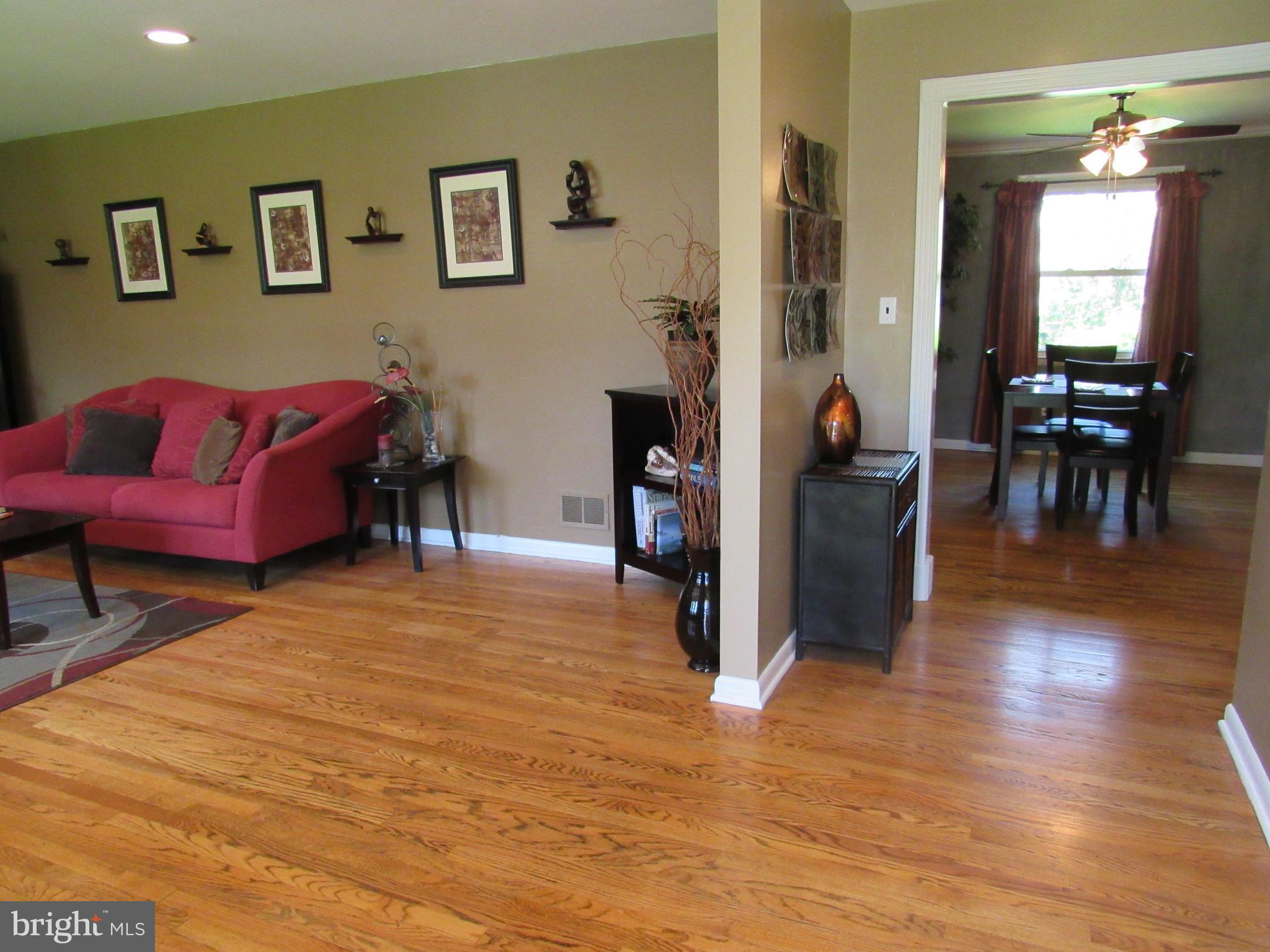 8710 Windsor Mill Road Baltimore, MD 21244 - Photo 2 of 30 a living room with furniture and a wooden floor