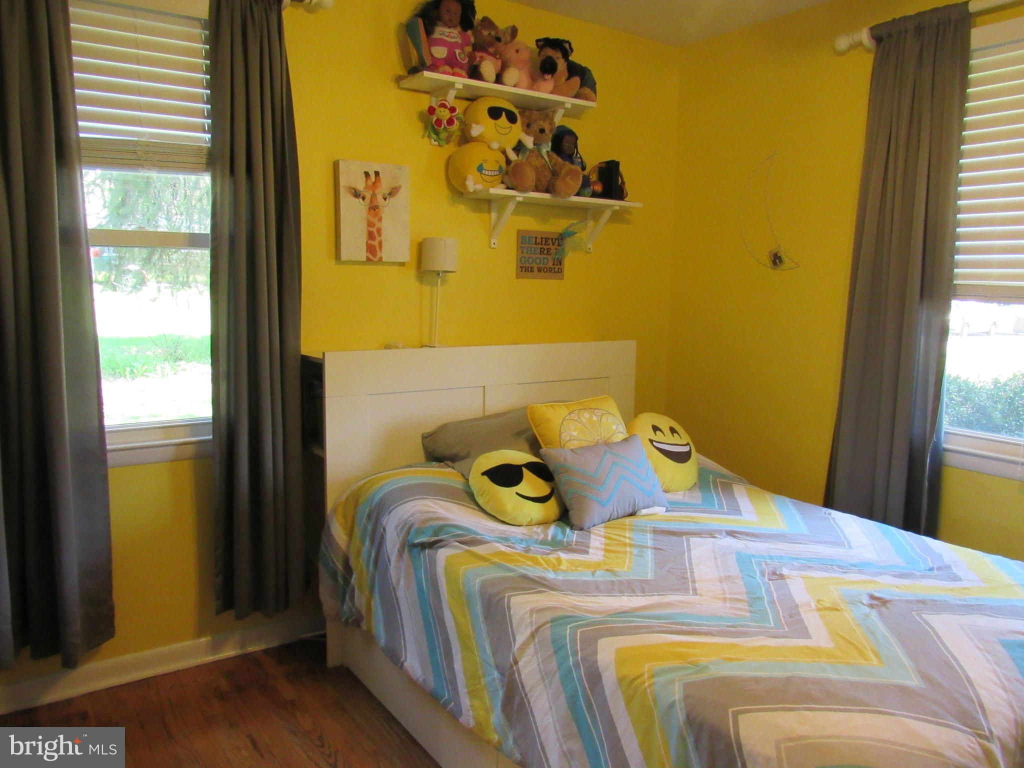 8710 Windsor Mill Road Baltimore, MD 21244 - Photo 19 of 30 a bedroom with a bed and a window