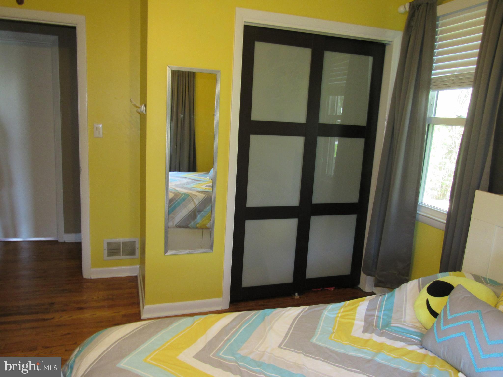 8710 Windsor Mill Road Baltimore, MD 21244 - Photo 20 of 30 a bedroom with a bed and a window