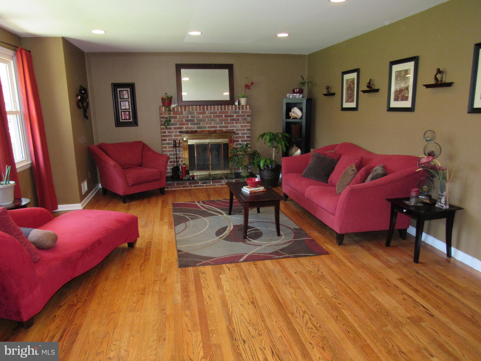 8710 Windsor Mill Road Baltimore, MD 21244 - Photo 4 of 30 a living room with furniture and a fireplace
