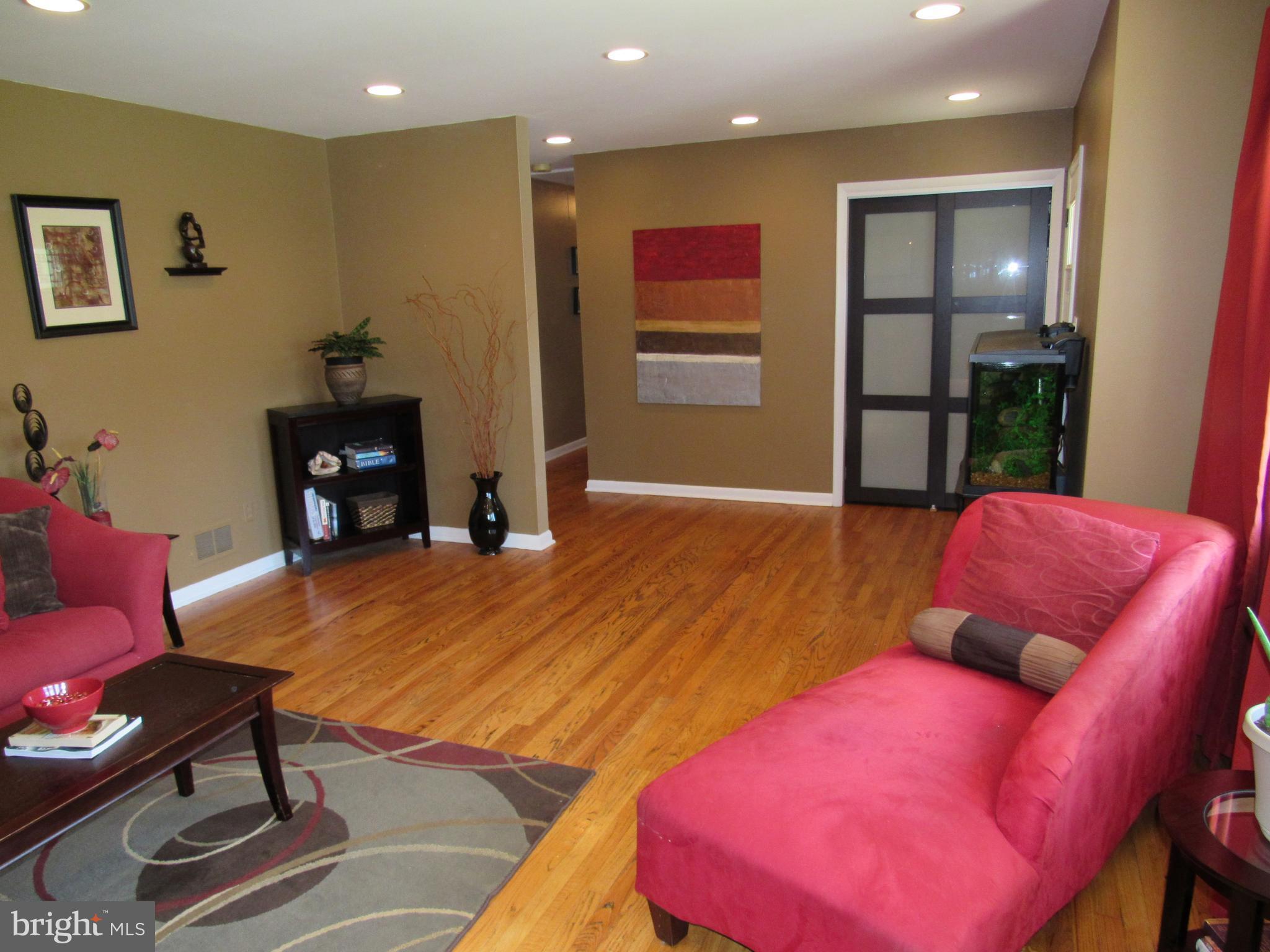 8710 Windsor Mill Road Baltimore, MD 21244 - Photo 6 of 30 a living room with furniture and a wooden floor