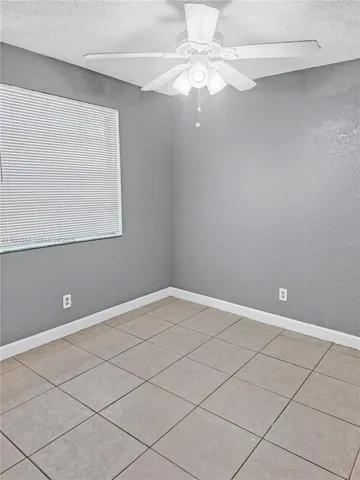 a view of a room that has a window in it