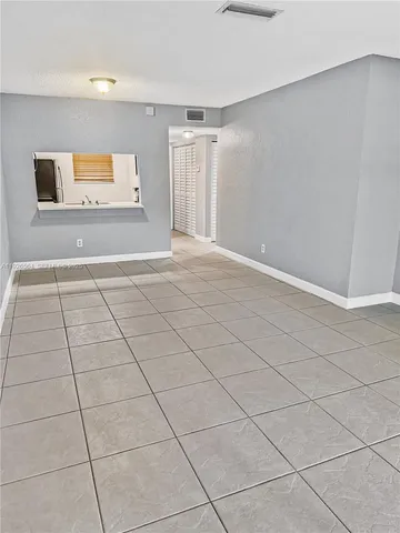 a view of an empty room and window