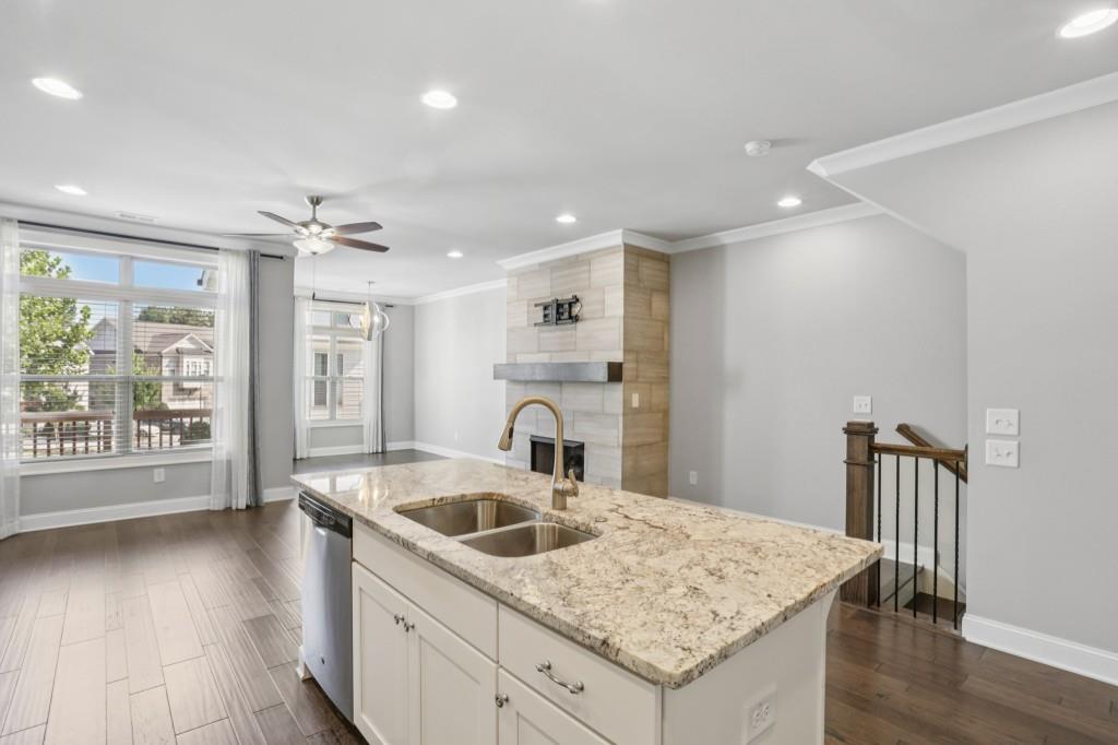 3899 Glenview Club Lane Duluth, GA 30097 - Photo 13 of 38 a kitchen with a sink a stove and cabinets