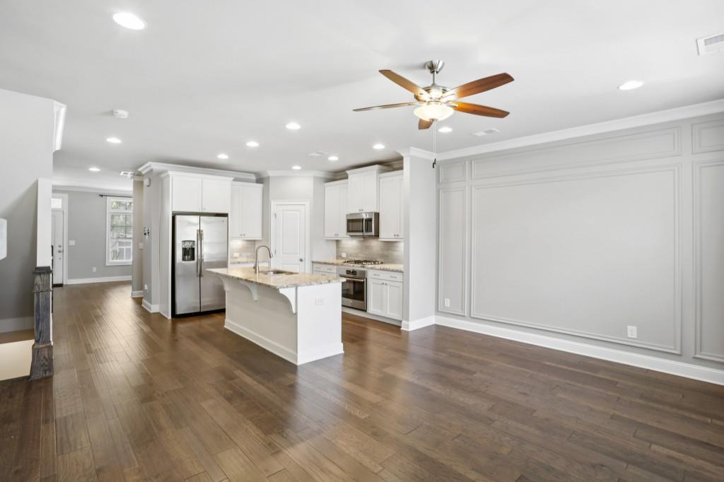 3899 Glenview Club Lane Duluth, GA 30097 - Photo 15 of 38 a view of kitchen with kitchen island refrigerator stove and white cabinets