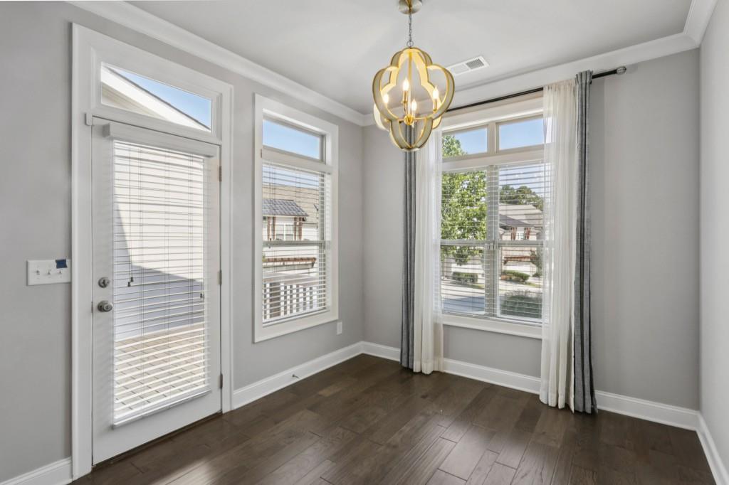 3899 Glenview Club Lane Duluth, GA 30097 - Photo 18 of 38 a view of empty room with wooden floor and fan