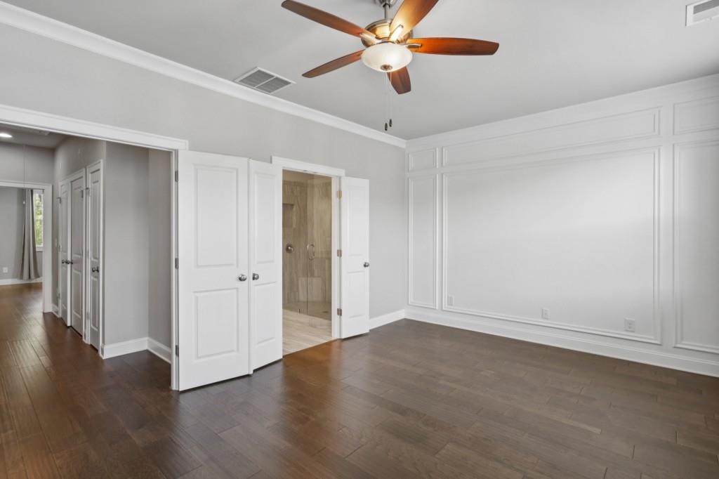 3899 Glenview Club Lane Duluth, GA 30097 - Photo 21 of 38 a view of an empty room with wooden floor