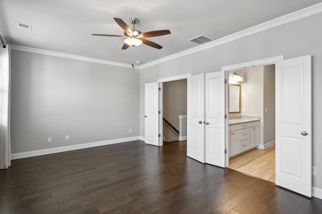 3899 Glenview Club Lane Duluth, GA 30097 - Photo 22 of 38 a view of an empty room and wooden floor