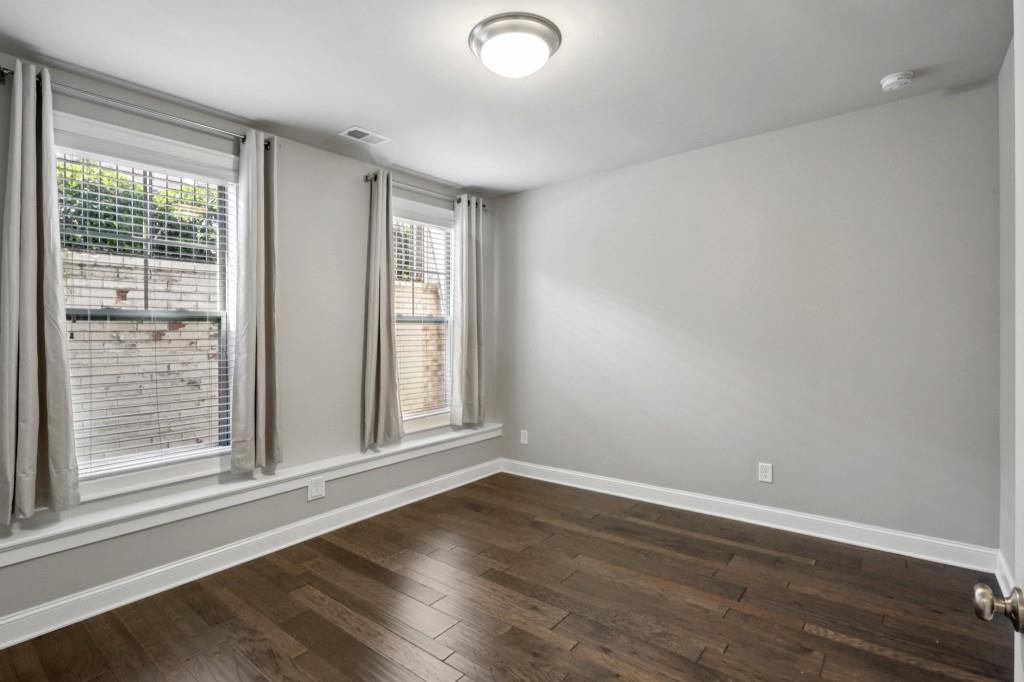 3899 Glenview Club Lane Duluth, GA 30097 - Photo 31 of 38 a view of empty room with wooden floor and fan