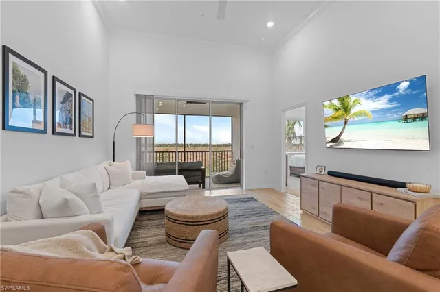 a bedroom with a bed and a night stand