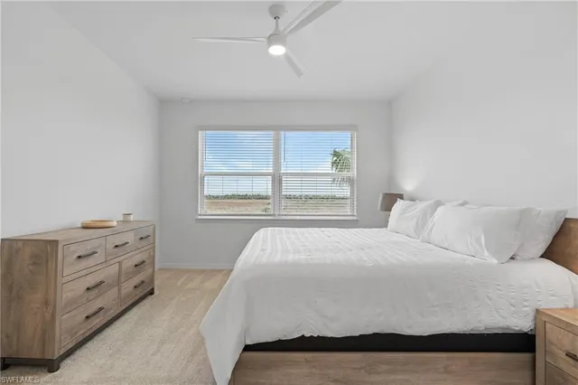 a bathroom with a double vanity sink mirror and shower