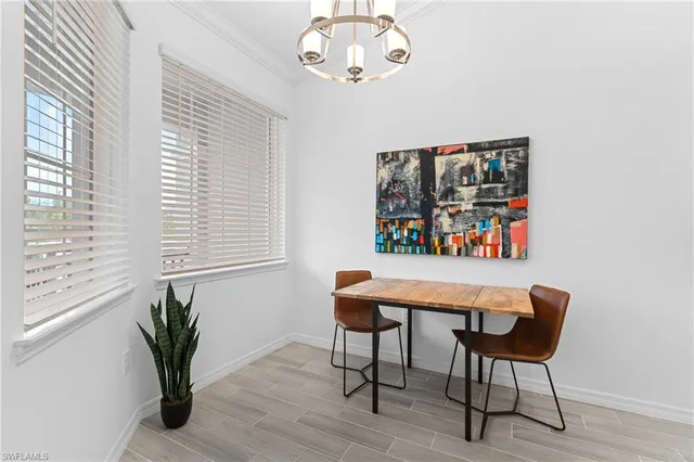 a kitchen with a sink a stove and cabinets