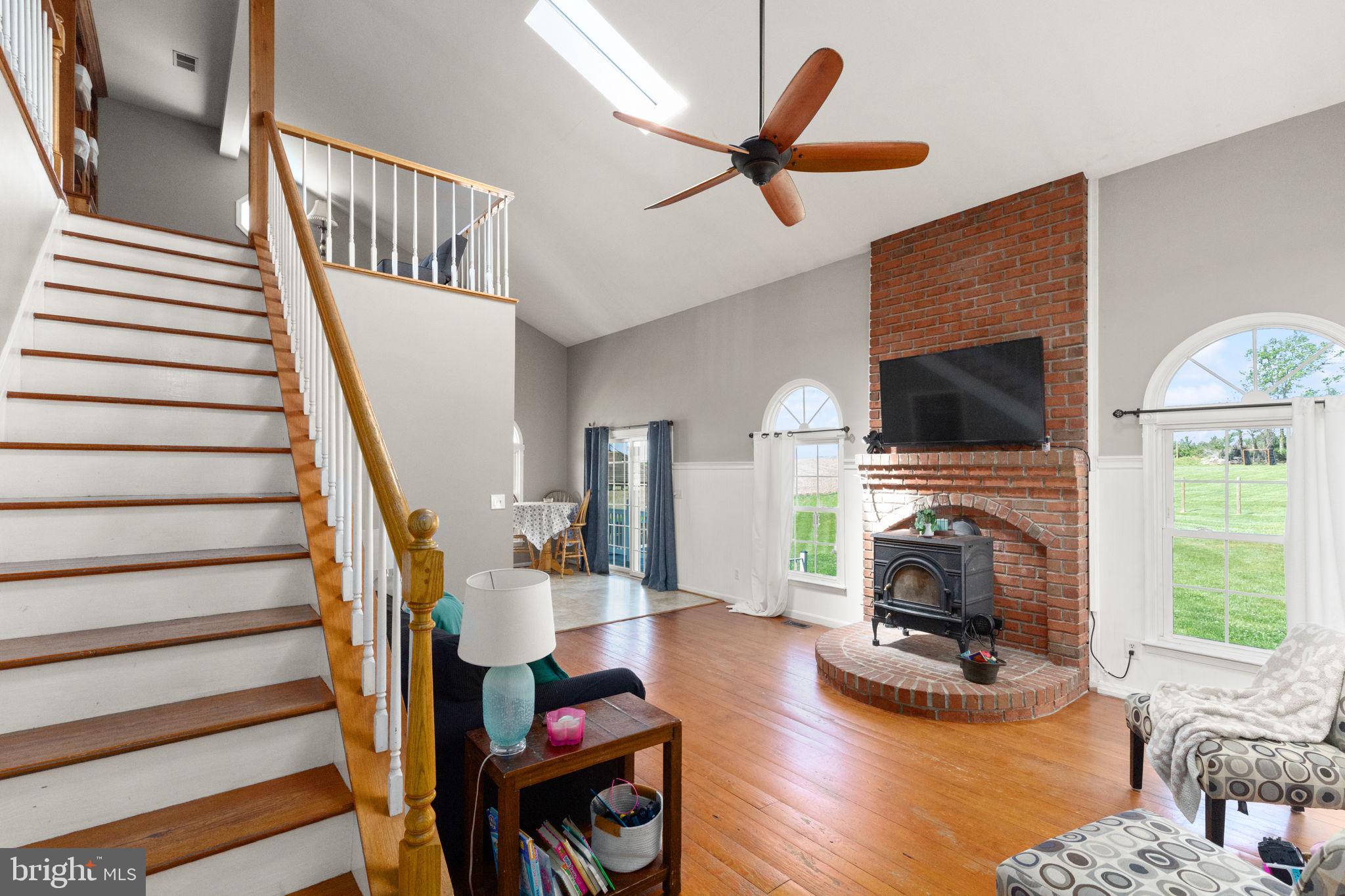 2140 Marston Road New Windsor, MD 21776 - Photo 7 of 48 a living room with furniture a fireplace and a flat screen tv