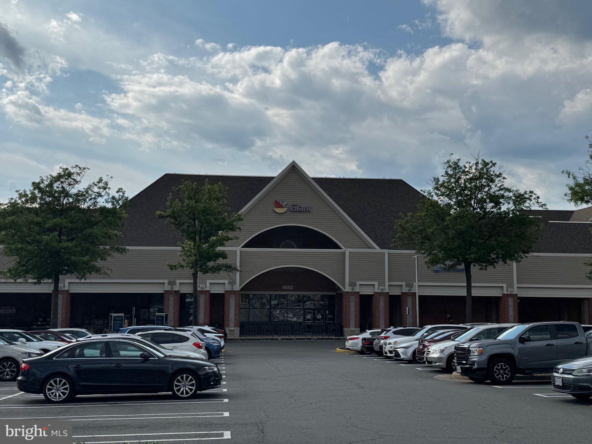 1319 Vintage Place Reston, VA 20194 - Photo 32 of 37 Inviting storefront under a cloudy sky.