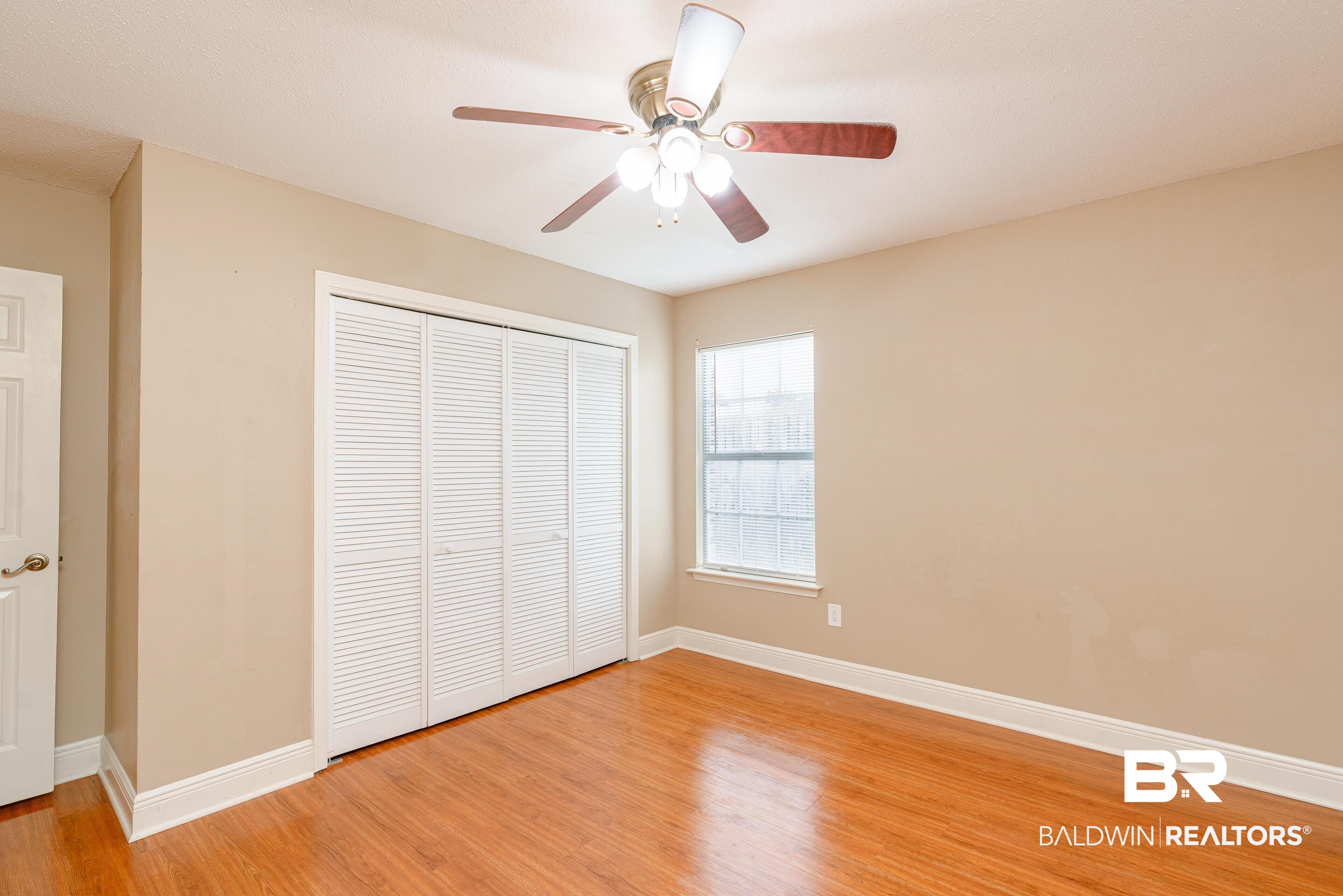 23 Old Mill Court Mobile, AL 36608 - Photo 28 of 37 Unfurnished bedroom with light hardwood / wood-style flooring, a closet, and ceiling fan