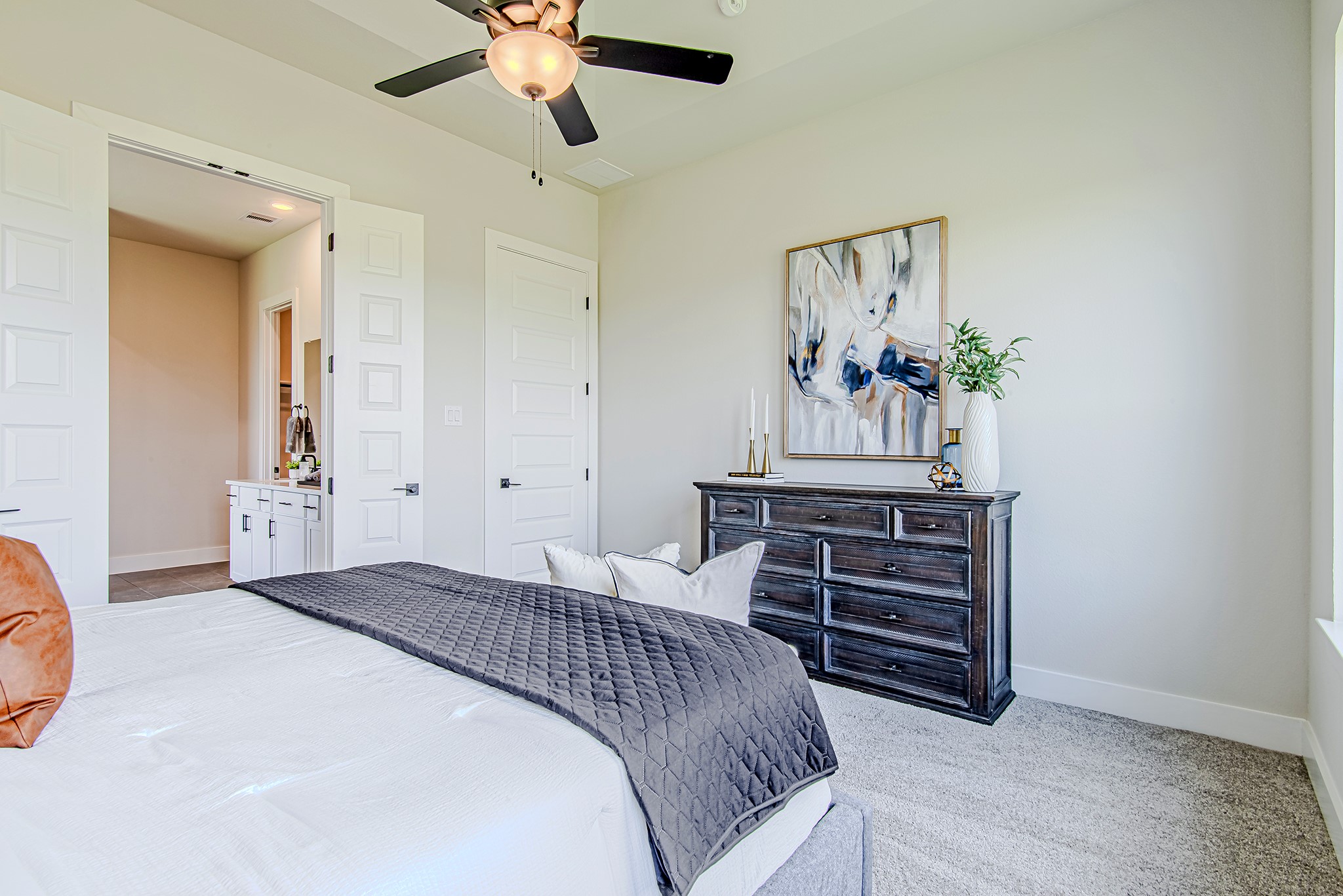 141 Peninsula Point Drive Montgomery, TX 77356 - Photo 21 of 47 Spacious and stylish, the primary suite offers plenty of room for furniture placement and includes access to a spa-like bath.