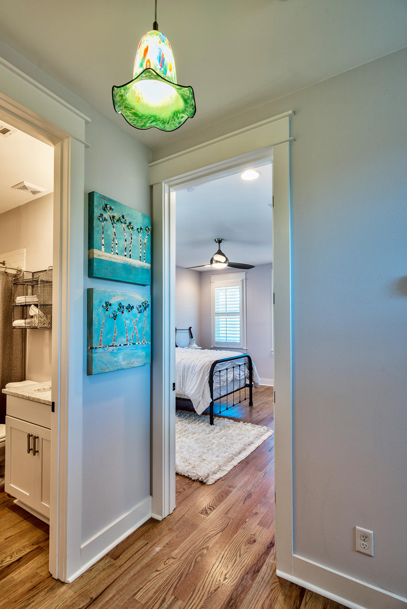 19 Dune Ridge Road Santa Rosa Beach, FL 32459 - Photo 14 of 29 a bedroom with a bed and a chandelier