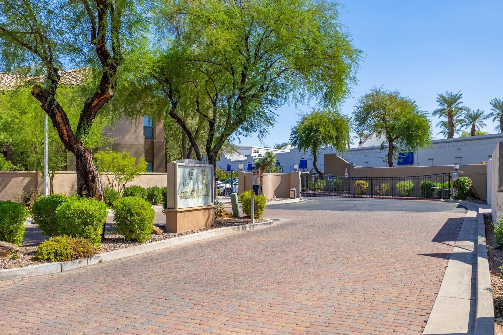 7027 North Scottsdale Road, Unit 225 Scottsdale, AZ 85253 - Photo 13 of 48 a view of road with a building and trees in the background
