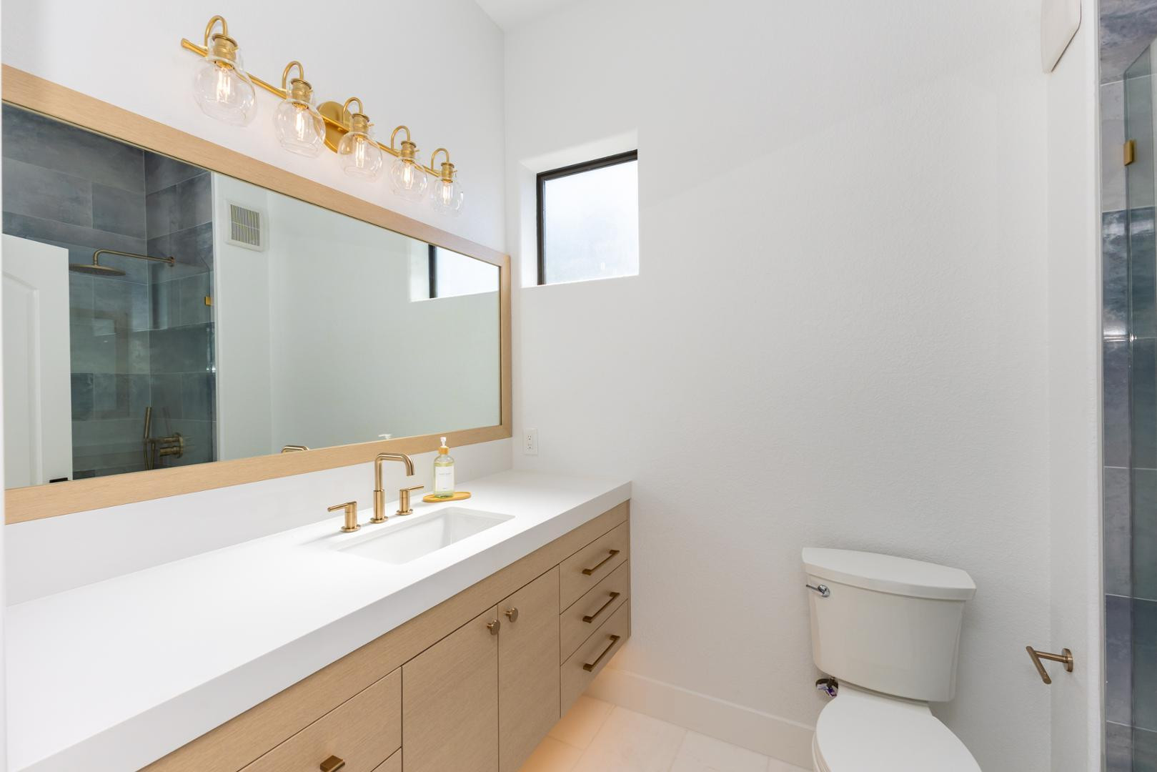 7027 North Scottsdale Road, Unit 225 Scottsdale, AZ 85253 - Photo 24 of 48 a bathroom with a sink a toilet and mirror