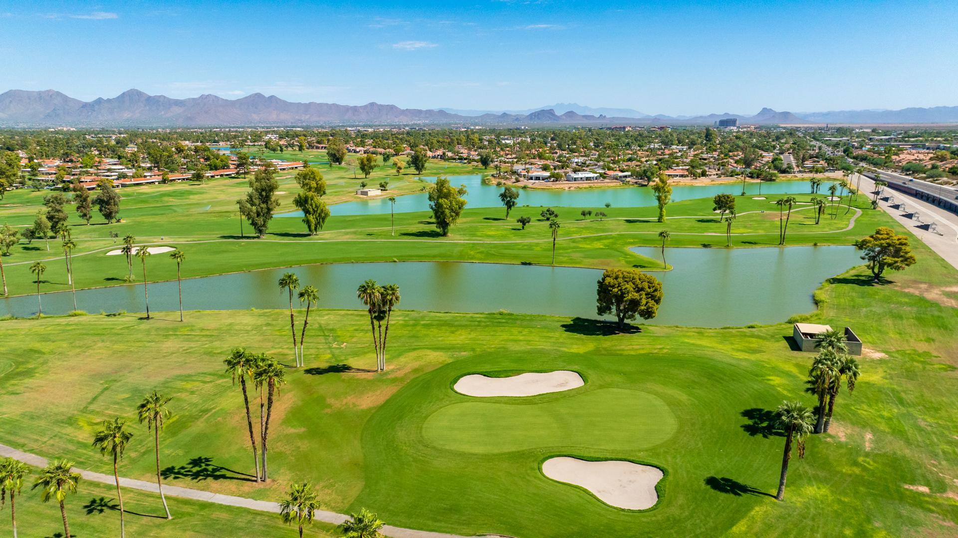 7027 North Scottsdale Road, Unit 225 Scottsdale, AZ 85253 - Photo 34 of 48 a view of a city with a lake