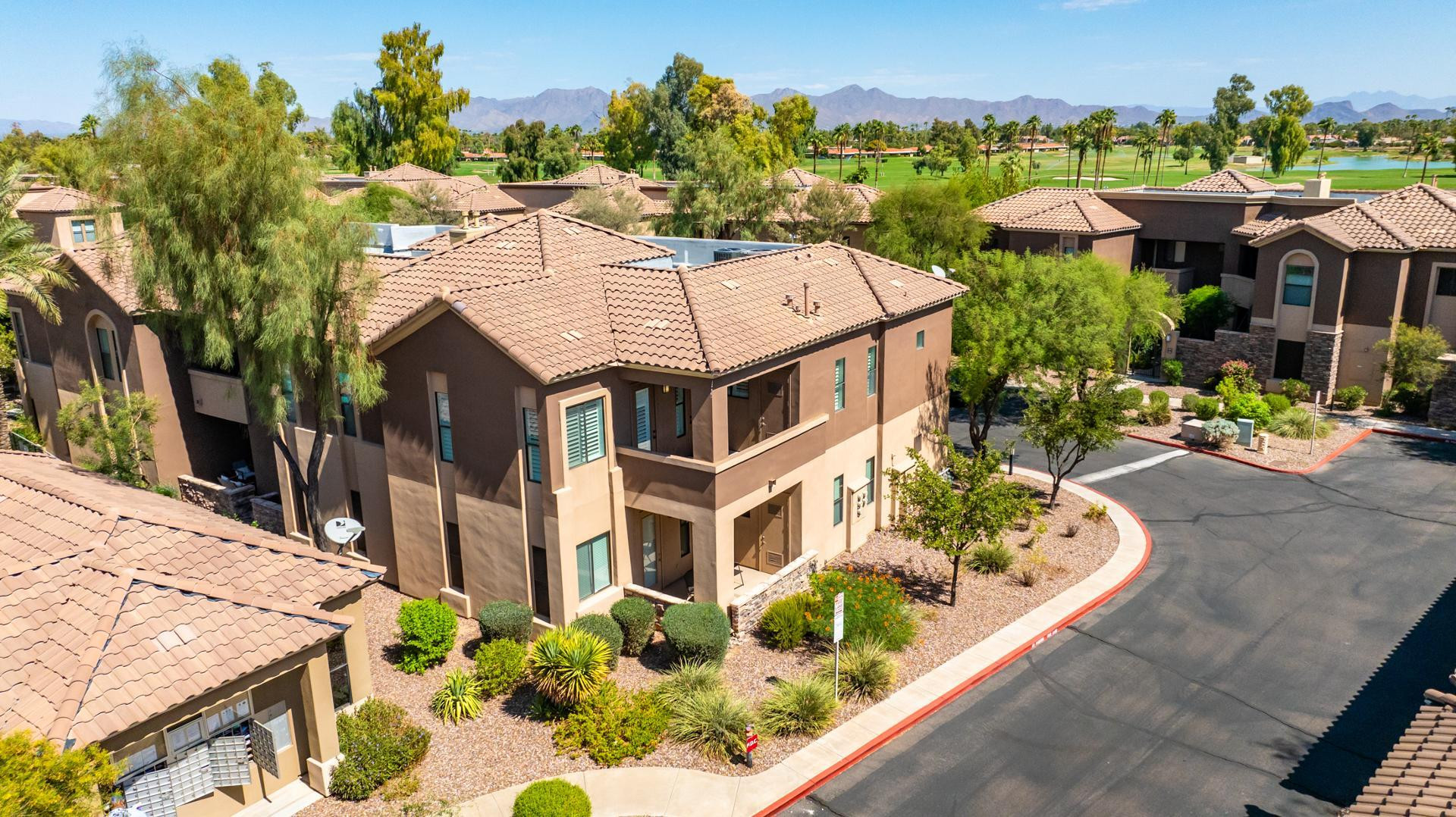 7027 North Scottsdale Road, Unit 225 Scottsdale, AZ 85253 - Photo 41 of 48 a aerial view of a house with a yard and potted plants
