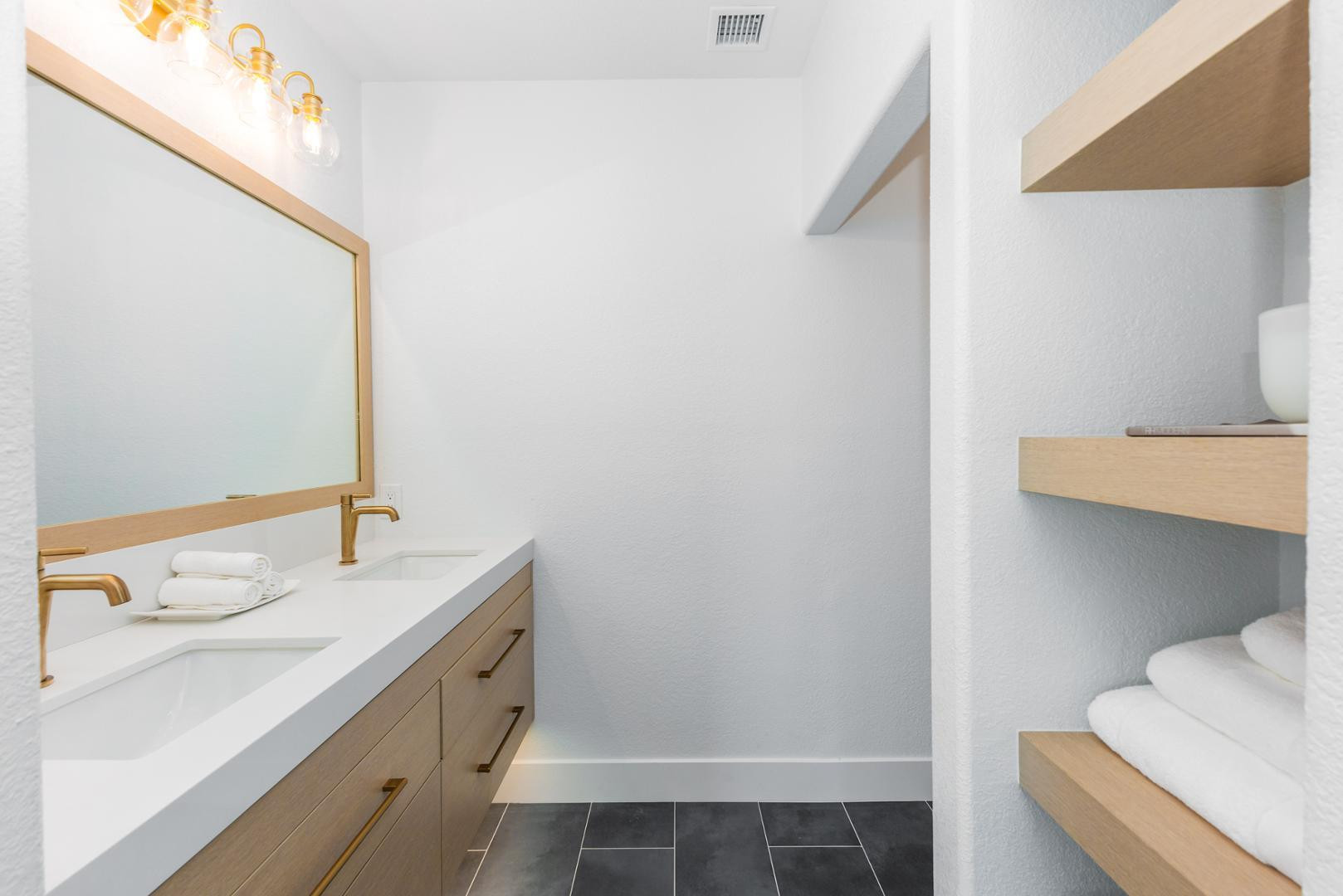 7027 North Scottsdale Road, Unit 225 Scottsdale, AZ 85253 - Photo 8 of 48 a bathroom with a sink and a mirror