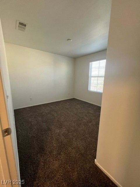 4561 Woolcomber Street Las Vegas, NV 89115 - Photo 9 of 19 Carpeted empty room with baseboards