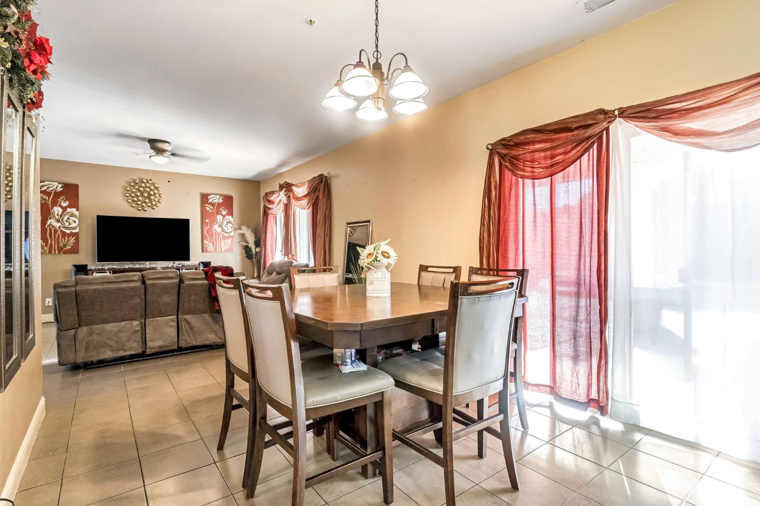 877 Sandra Avenue Sanger, CA 93657 - Photo 11 of 40 a view of a dining room with furniture and a flat screen tv