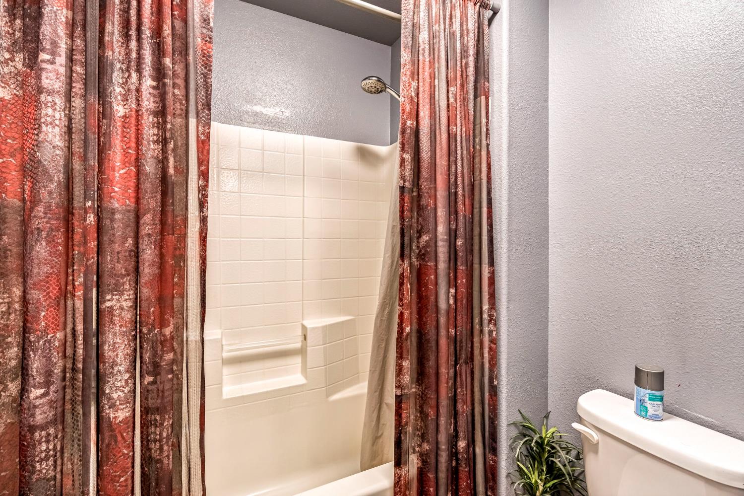 877 Sandra Avenue Sanger, CA 93657 - Photo 23 of 40 a bathroom with a shower and a toilet