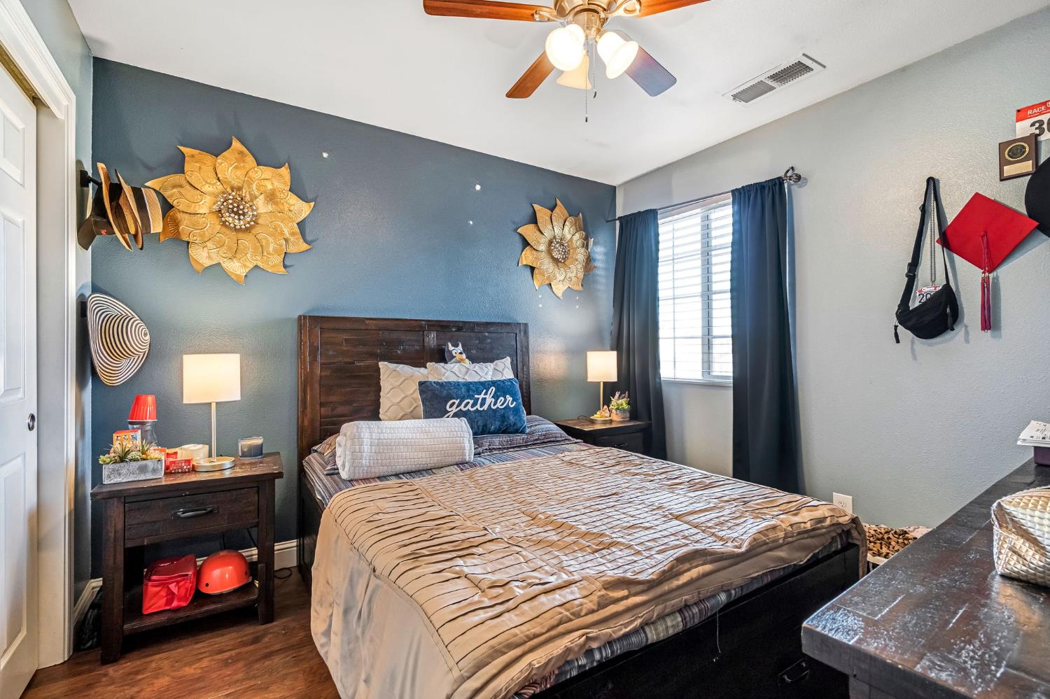 877 Sandra Avenue Sanger, CA 93657 - Photo 24 of 40 a bedroom with a bed and a chandelier