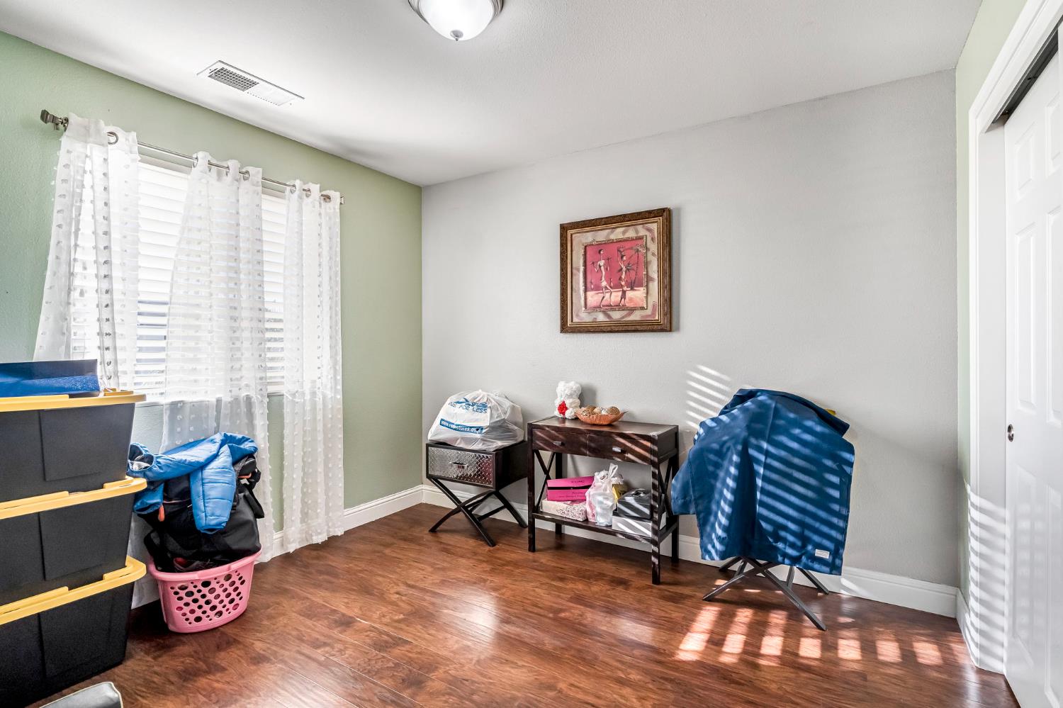 877 Sandra Avenue Sanger, CA 93657 - Photo 26 of 40 a bedroom with furniture and a large window