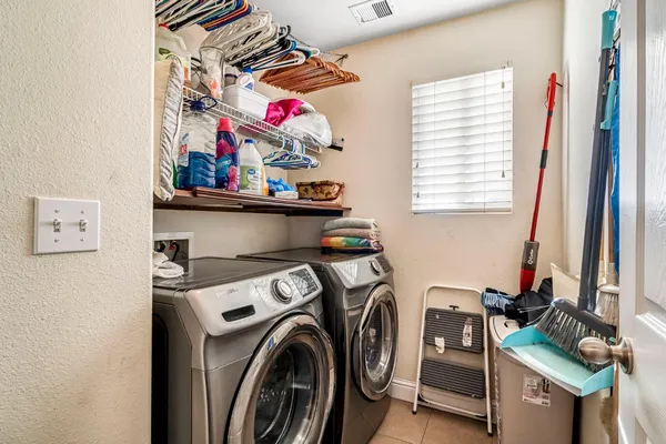 a view of washer and dryer in a utility room