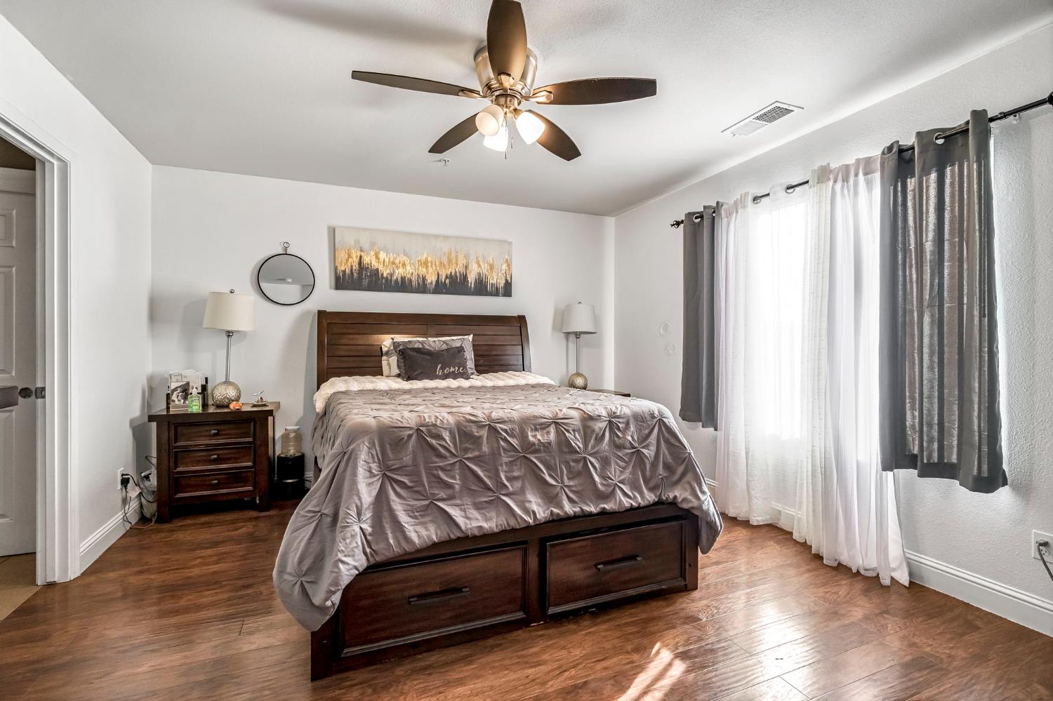 877 Sandra Avenue Sanger, CA 93657 - Photo 29 of 40 a bedroom with a bed and a window