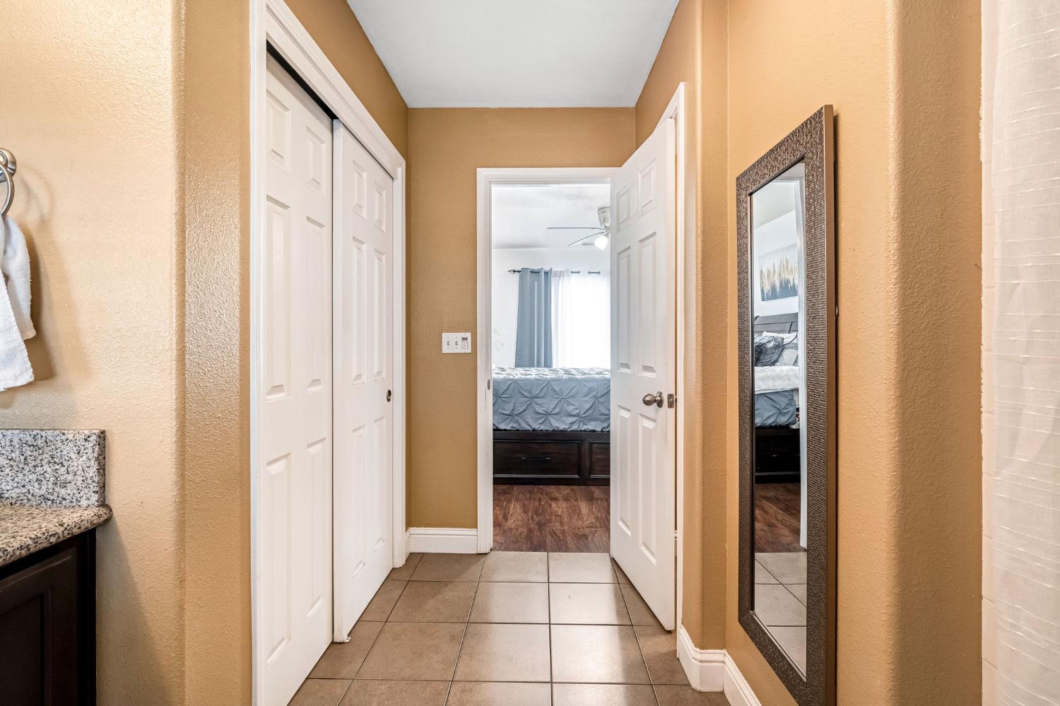 877 Sandra Avenue Sanger, CA 93657 - Photo 32 of 40 a view of a bathroom from a hallway