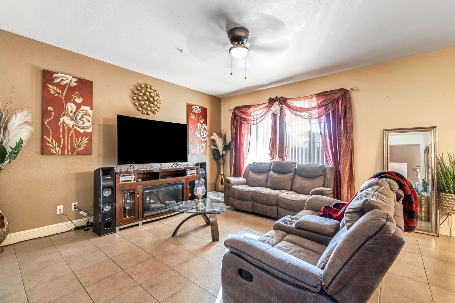 877 Sandra Avenue Sanger, CA 93657 - Photo 7 of 40 a living room with furniture and a flat screen tv