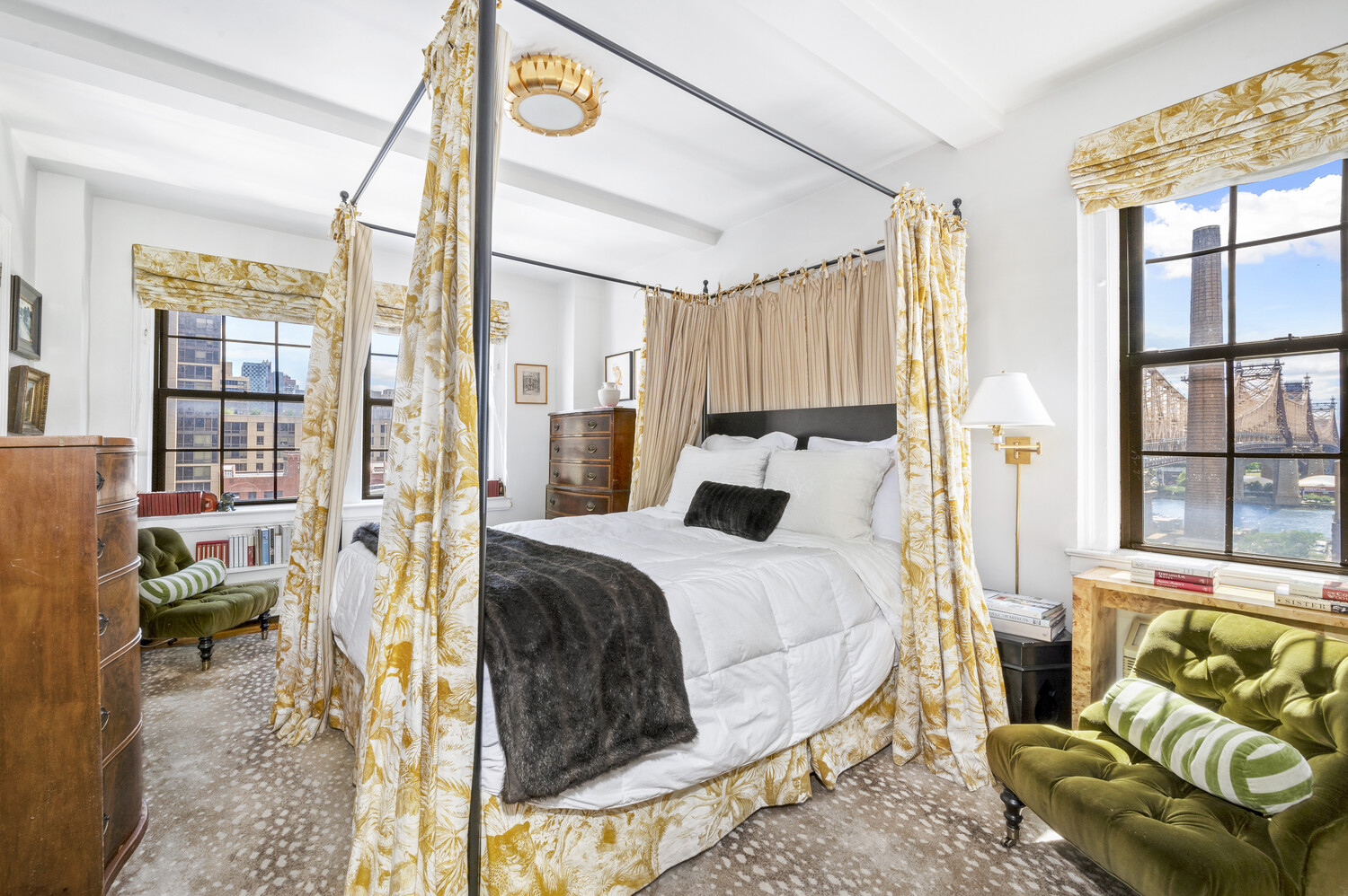 400 East 59th Street, Unit 10F Manhattan, NY 10022 - Photo 6 of 15 a bed room with a bed and a couch