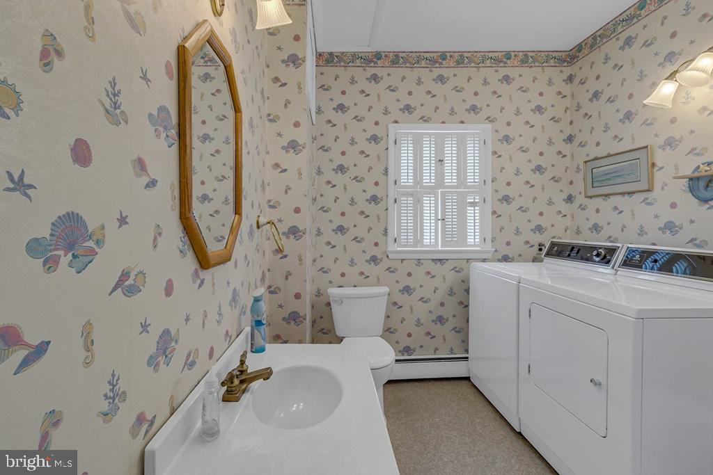 742 Main Street Reedville, VA 22539 - Photo 13 of 66 Charming laundry room with coastal flair.