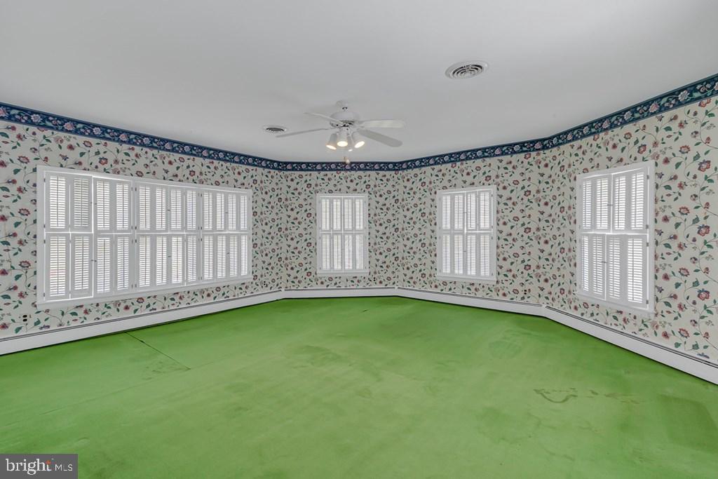 742 Main Street Reedville, VA 22539 - Photo 18 of 66 Charming room with floral accents.