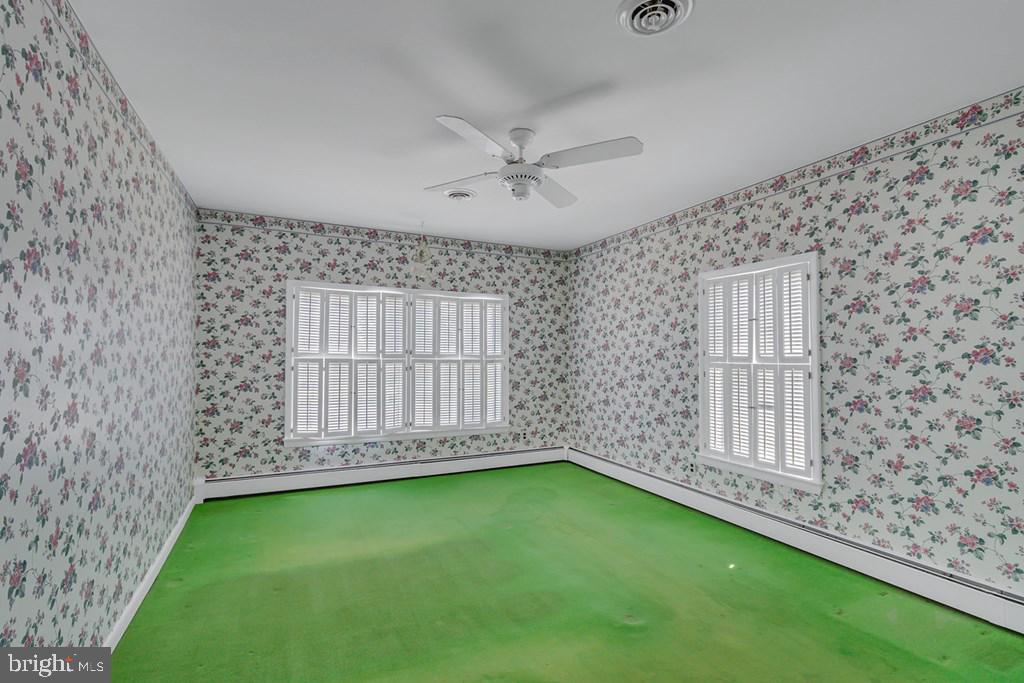 742 Main Street Reedville, VA 22539 - Photo 22 of 66 Charming floral retreat awaits revival.
