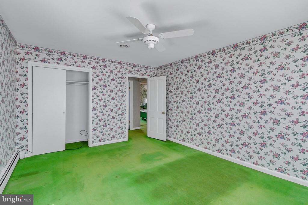 742 Main Street Reedville, VA 22539 - Photo 23 of 66 Charming floral retreat awaits revival.