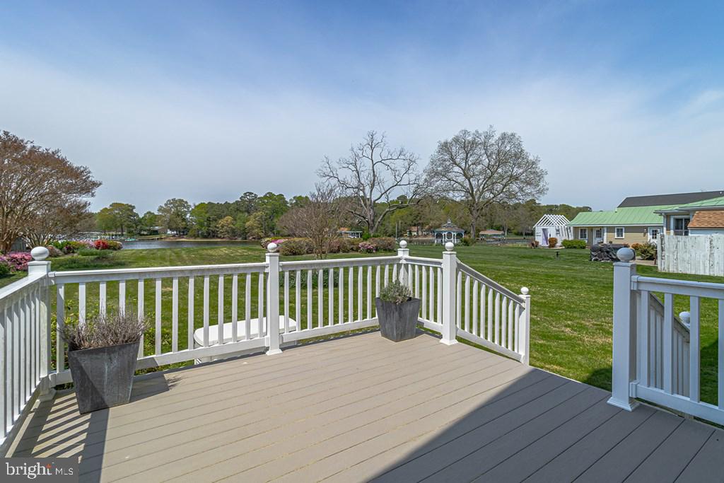 742 Main Street Reedville, VA 22539 - Photo 62 of 66 Serene waterfront deck with lush views.