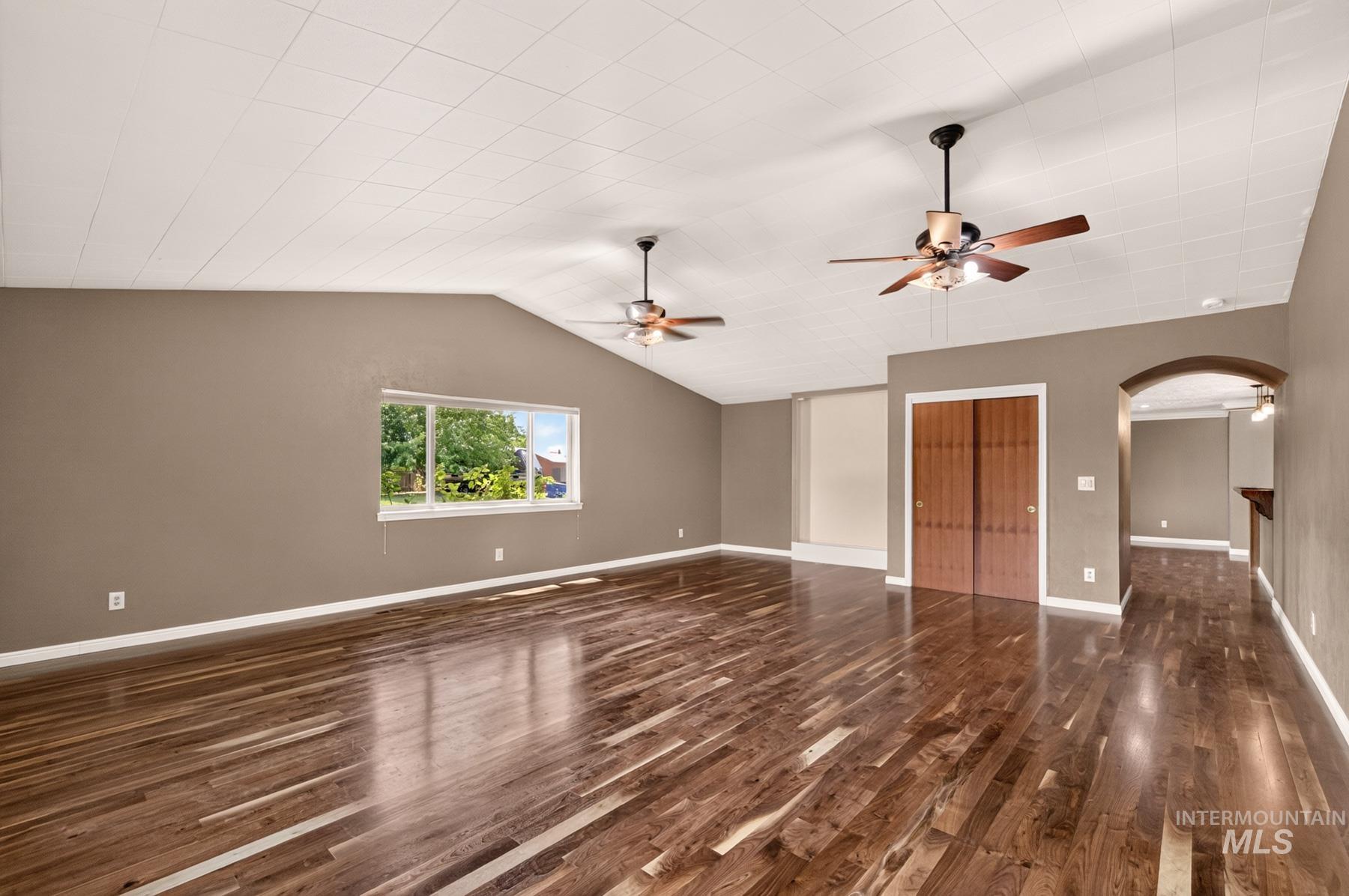 9622 Delaware Street Boise, ID 83709 - Photo 22 of 48 Spacious room featuring wood-finish flooring, vaulted ceilings, and twin ceiling fans