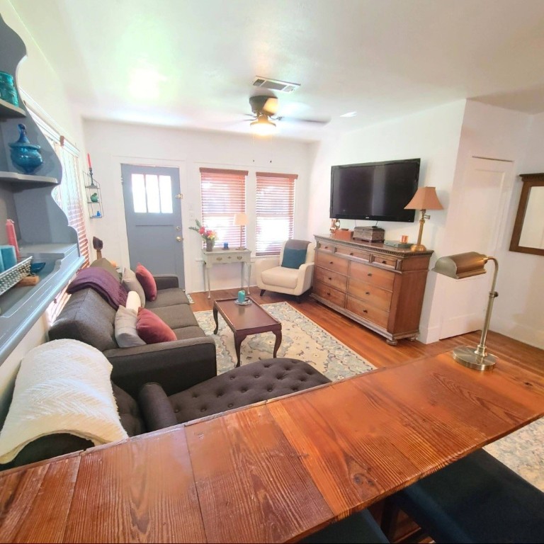 1427 Munger Street Houston, TX 77023 - Photo 3 of 24 a bedroom with furniture and a flat screen tv