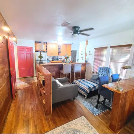 a living room with furniture and a table