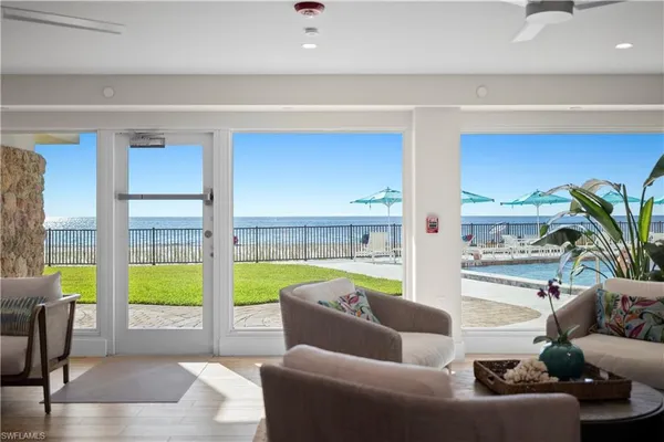 a living room with furniture and a garden