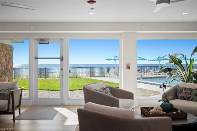 a living room with furniture and a garden