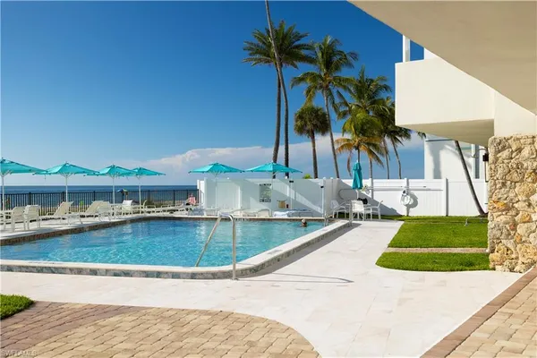 a view of a backyard with a patio and plants