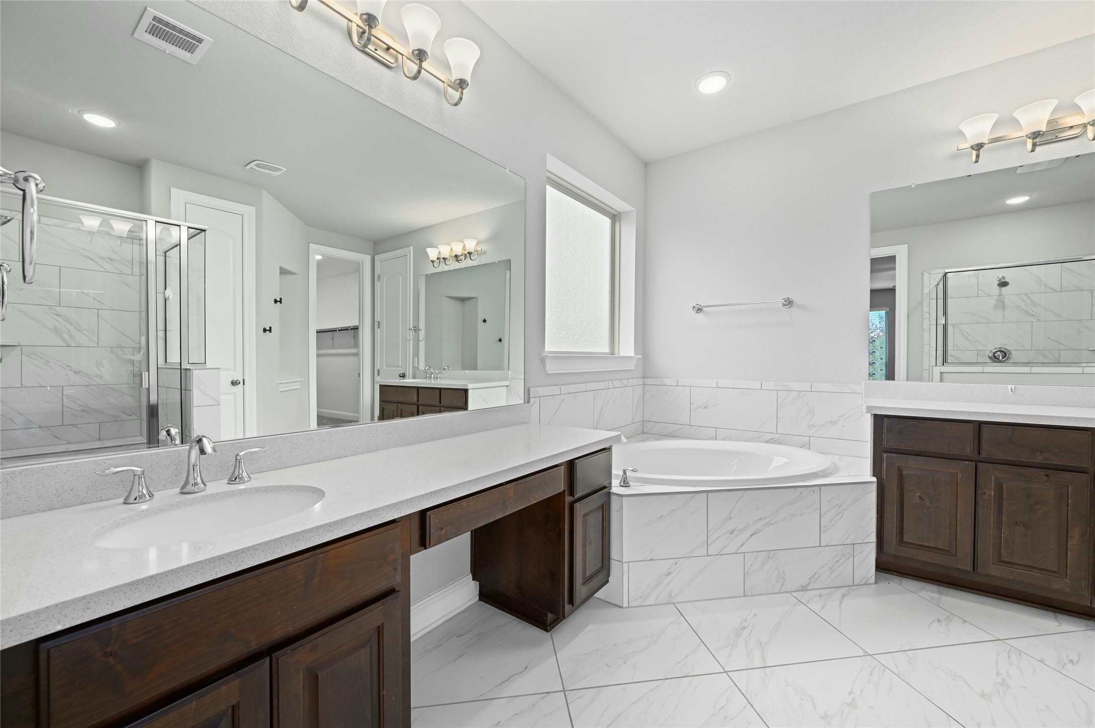 4124 Florentine Road Leander, TX 78641 - Photo 16 of 37 Bathroom with vanity and plus walk in shower