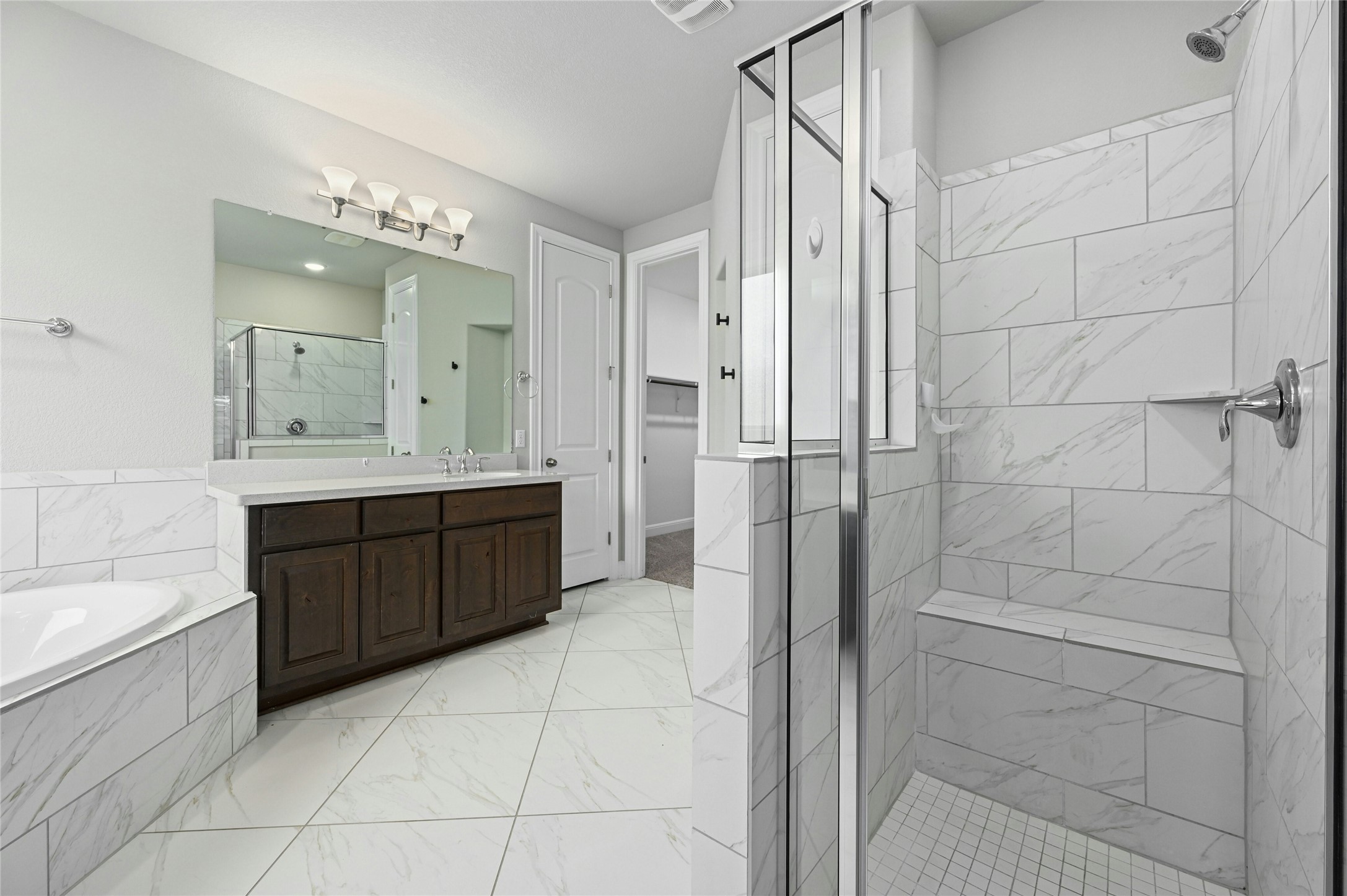 4124 Florentine Road Leander, TX 78641 - Photo 17 of 37 Bathroom with vanity and separate shower and tub